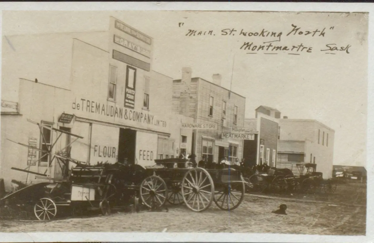 Main Street looking north, with storefronts and wagons, about 1912