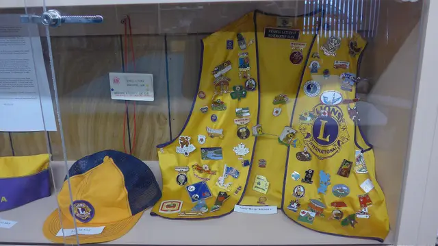 Lions Club vest and cap display at the Mini Museum